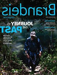 Winter 2023/2024 Magazine cover featuring a man walking through the dark woods